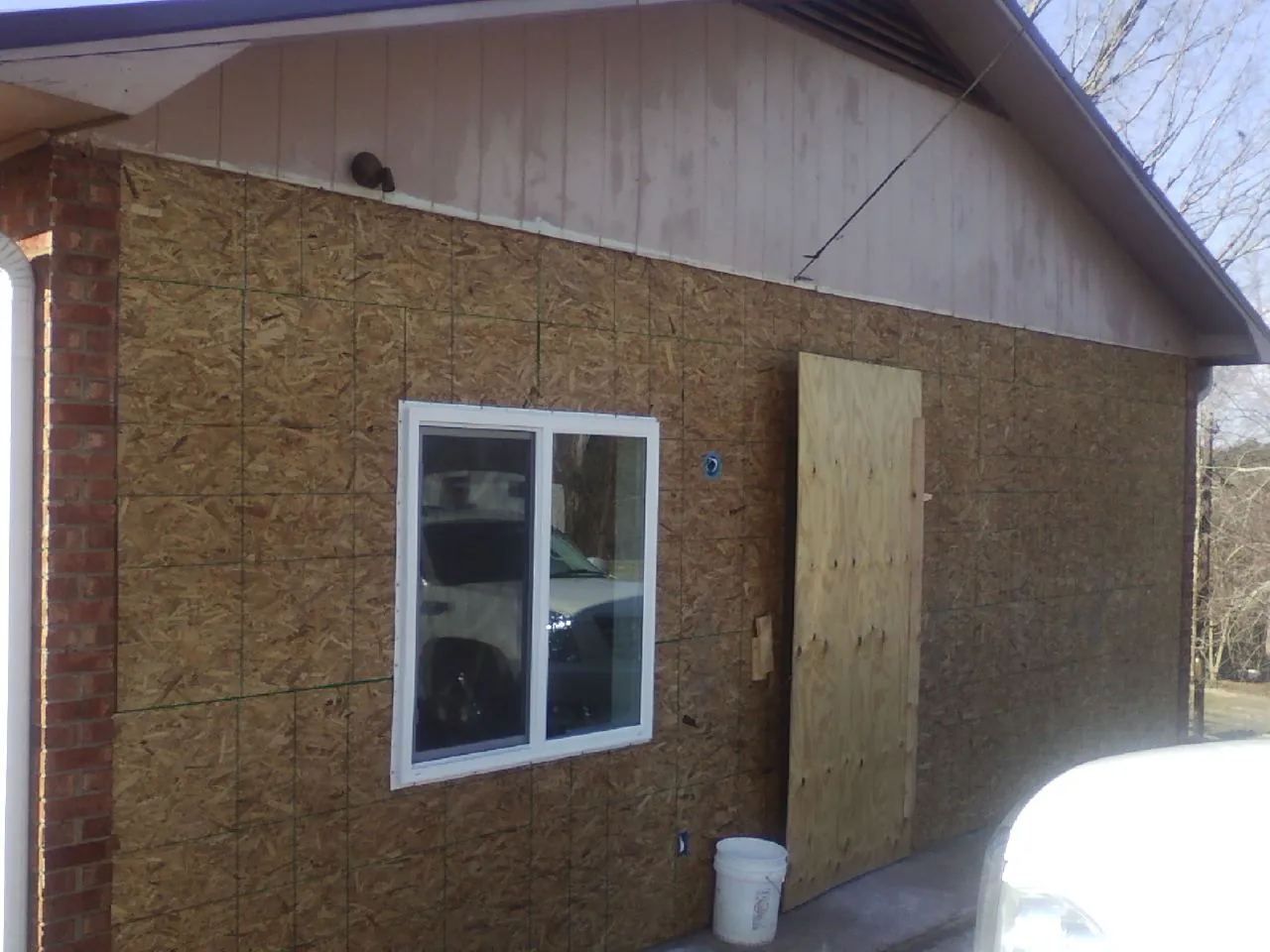 OSB sheathing on a garage addition wall before siding in Barbourville